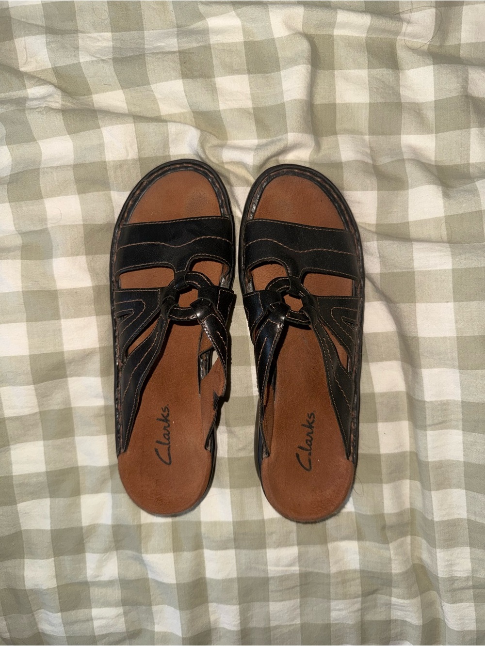 Clarks Black Leather Slip-On Sandals with Brown Footbed